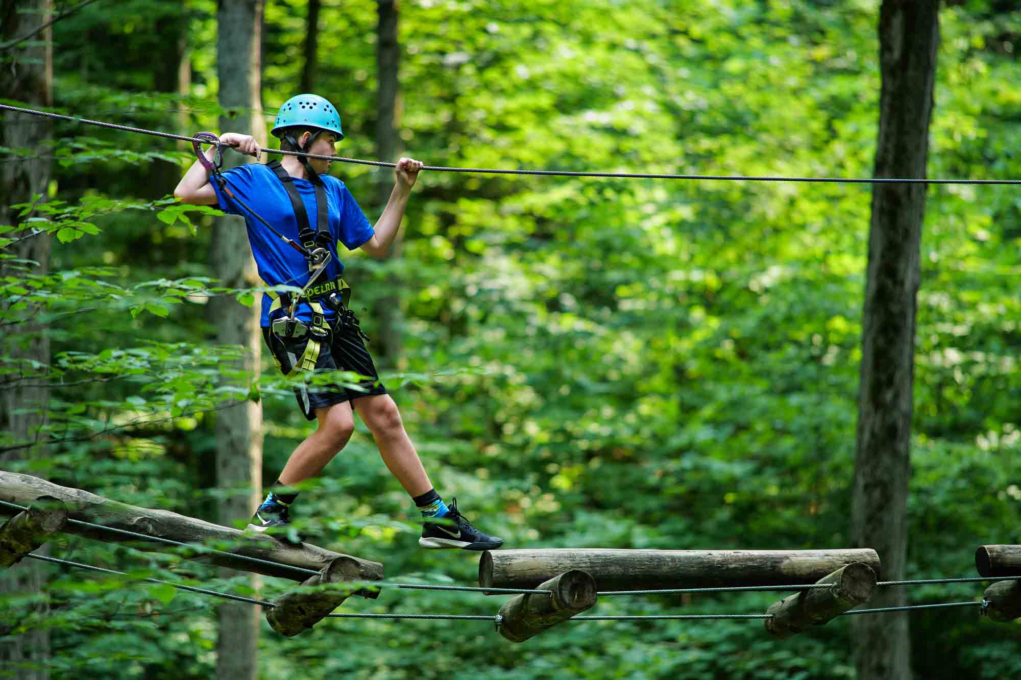 man trying out treetop trekking