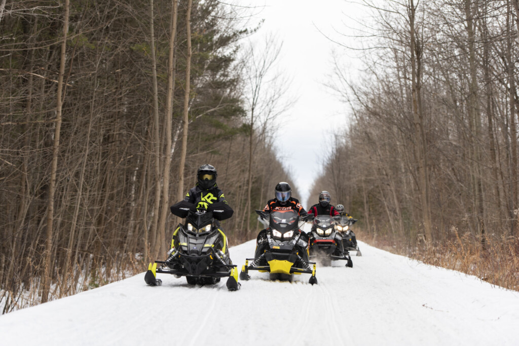 Snowmobilers on trail